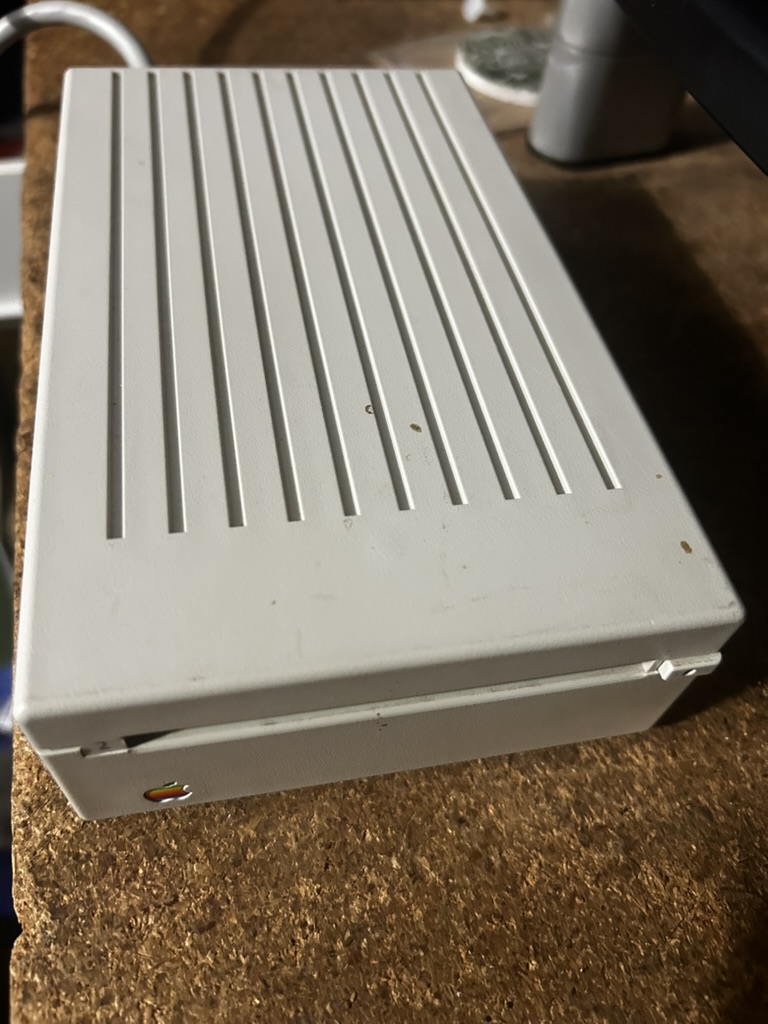 Vintage Apple external hard drive with rainbow Apple logo, top view